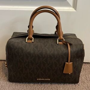 Like New Michael Kors Vintage Signature top handle bag with cross body strap.